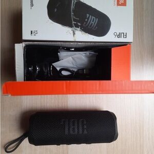 JBL Black Portable Bluetooth Speaker with Compact Design and Carry Strap